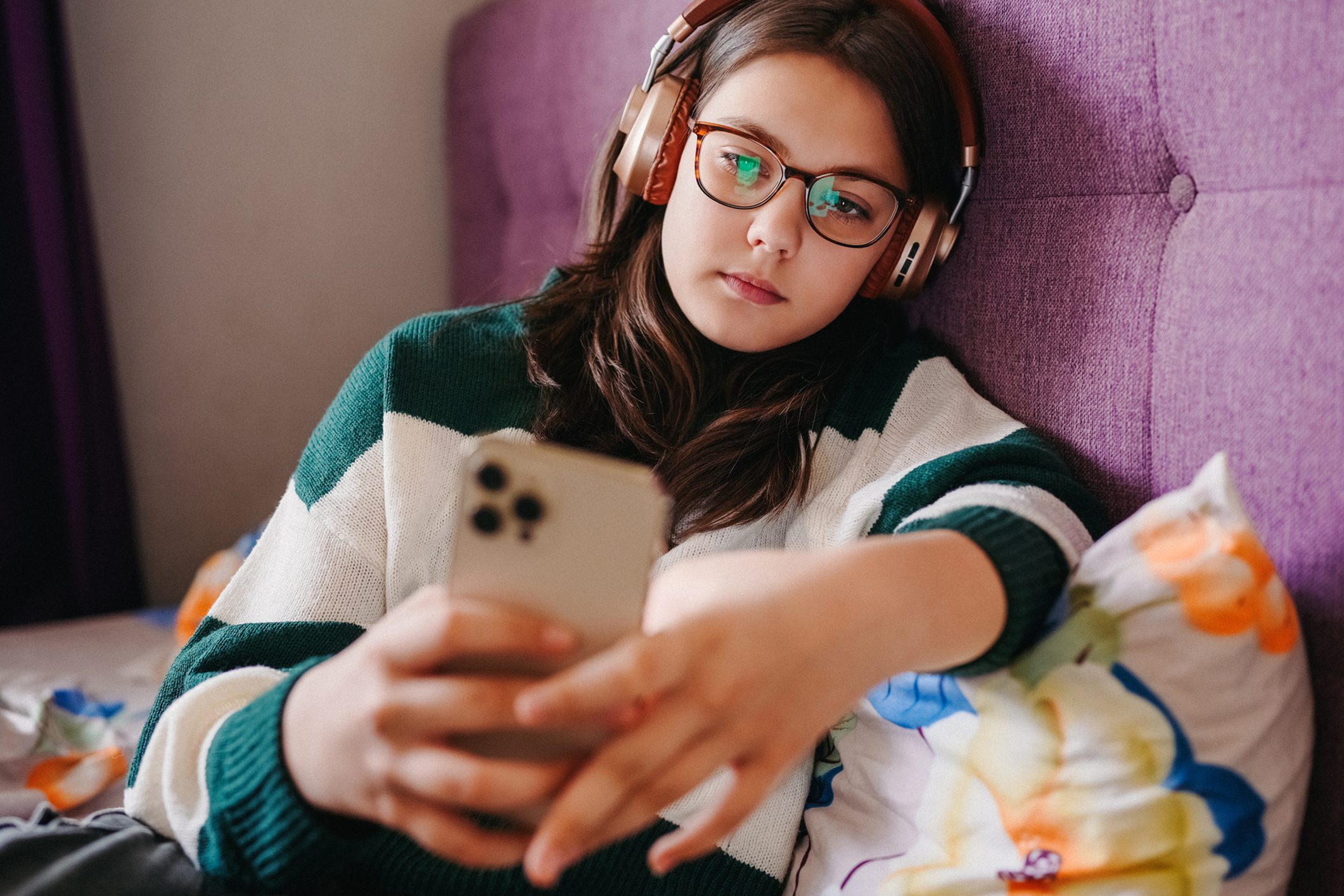 Teen looking at phone.